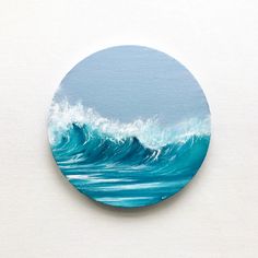 a painting of a blue ocean wave on a white surface with the sky in the background