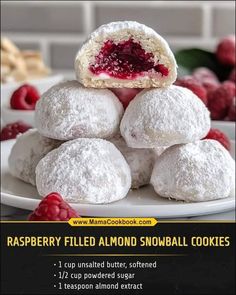 raspberry filled almond snowball cookies on a plate