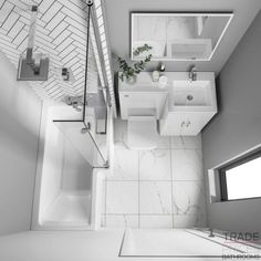 an aerial view of a bathroom with white fixtures