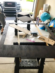 a man is working on a table in a garage