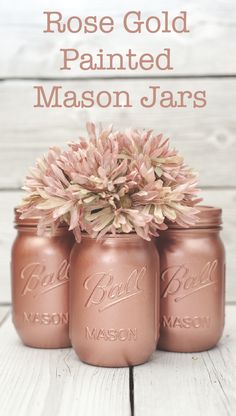 three mason jars with pink flowers in them and the words rose gold painted mason jars