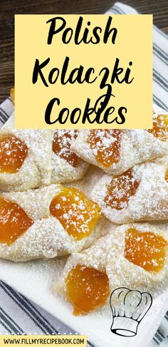 polish kolaciki cookies with powdered sugar and jelly toppings on a white plate