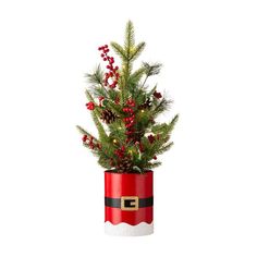 a small christmas tree in a red tin can with lights on it's side