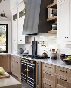 a kitchen with an oven, stove and counter tops in it's center island