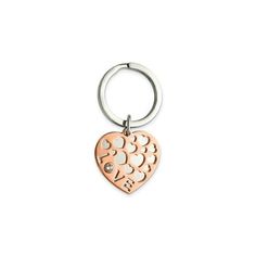 a heart shaped keychain with the word love on it's front and bottom