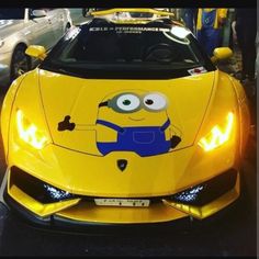 a yellow sports car with a minion painted on it's hood and front lights