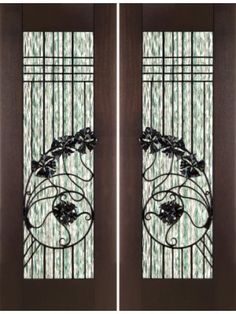 two brown doors with glass panels and wrought iron designs on them, both side by side