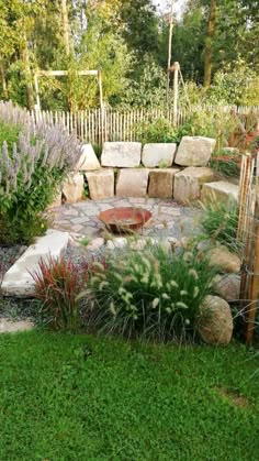 a garden with rocks and plants in it