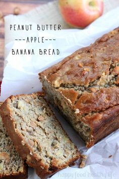 two slices of banana bread sitting next to an apple