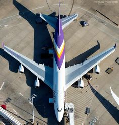 an airplane is parked on the tarmac