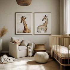 a baby's room with two giraffes on the wall