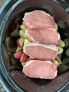 raw meat and vegetables in a slow cooker ready to be put into the crock pot