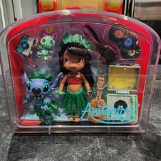 an action figure in a plastic case on a counter top with other toys behind it