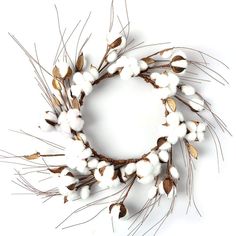 a wreath made out of cotton and leaves