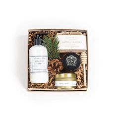 the gift box contains an assortment of handmade soaps, body lotion and pine cones