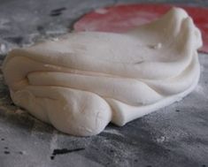 a piece of white food sitting on top of a table