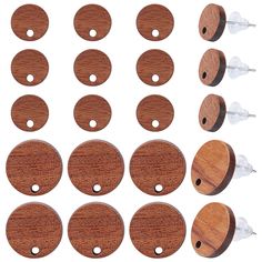 wooden buttons and pins are arranged on a white background