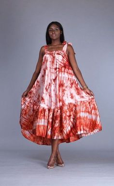 🎈This Adire silk dress is made of high quality adire silk (Nigerian tie dye) that feels good on the skin. Look simple, yet sophisticated enough to steal all the attention. 🎈Details -Size : One size fits all (loose fit) - Has belt Straps at the shoulder for easy tying - Has a hidden belt inside the dress for a tighter fit - 2 Side Pockets -Length 49 inches (it can be adjusted to your desired length) -Neckline: Round -100% West African Silk -Fabric is hand dyed in Nigeria -Handmade in Nigeria - Adire Kaftan Styles, African Tie Dye, Kaftan Styles, African Fashion Skirts, African Maxi Dresses, Dress African, Handmade African, Dye Dress, African Print Dresses