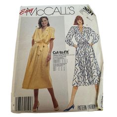 a women's dress and coat sewing pattern from the 1970's, with an attached belt