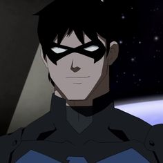 an animated image of batman in the dark knight suit with his eyes wide open, staring at the camera