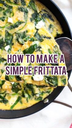 a skillet filled with eggs and spinach on top of a white tablecloth