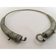 Traditional torque or Hansuli silvered necklace choker from Lambadi or Banjara and Sugali People, Andhra Pradesh, India.t India, circa 1940. Fabulous vintage heavy spiral silvered plated choker necklace in wonderful vintage condition. Silver, but not of the standard of sterling. Spirals of thick silver wire develop in three sections to the left and to the right. On one side of the bridge is a loop, on the other a screw fitting. This sculptural and coiled choker looks truly amazing on any neck or Traditional Brass Choker Necklace, Traditional Silver Tilla Choker, Traditional Brass Choker, Silver Meenakari Ceremonial Choker, Rajasthani Choker Necklaces, Torque Necklace, Collar Choker, Andhra Pradesh, Rajasthan India