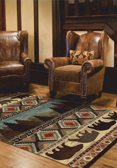 a living room with two chairs and a rug