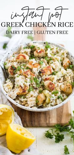 a bowl filled with rice and shrimp next to lemon wedges