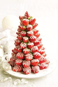 a christmas tree made out of chocolate covered strawberries