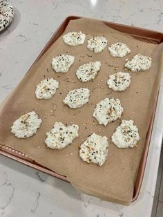 there are many small crackers on the baking sheet ready to go into the oven