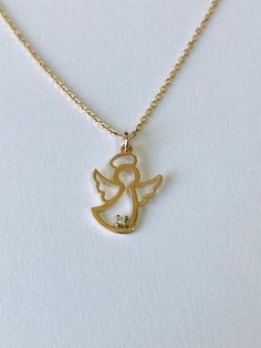 This angel charm necklace is the perfect addition to any outfit.You can layer it with your favorite necklaces or alone.14K Rose Gold Angel Necklace is solid gold. (not filled or not plated)Charm size isheigh: 14 mmwide :  10 mmlenght: 16'' - 17'' - 18'' inches.It has small cubic zirconia stone on it. Gold Birthstone Necklace, Mothers Day Rings, Engagement Rings Gold, Angel Wings Jewelry, Black Diamond Bracelet, K Rose, Gold Heart Ring, Angel Charm, Angel Jewelry