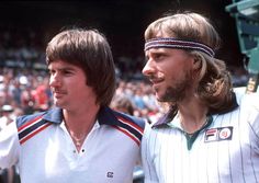 two men standing next to each other at a tennis match