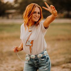 Simple silver belts are all the rage this season! Which means adding our Silver Concho Turquoise Stone Belt to your closet is a must. Wear with your favorite denim to make a statement all while showing off your western flair!  S/M is 42in end to end, but you can adjust the last 7-8in L/XL is 45.5in end to end, but you can adjust the last 7-8in. Concho Belt Outfit, Shock Everyone, Turquoise Belt, Nashville Style, Plain White Tee, Concho Belt, Cowgirl Chic, Silver Belts, Western Belts