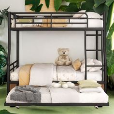 a teddy bear sitting on top of a bunk bed in a room filled with plants