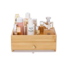 a wooden box filled with lots of different types of perfumes and lotion bottles