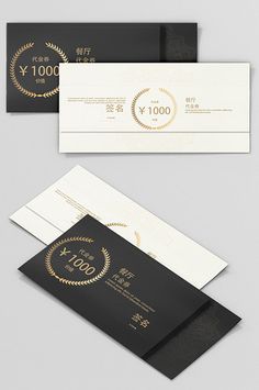 two black and white envelopes with gold foil on them