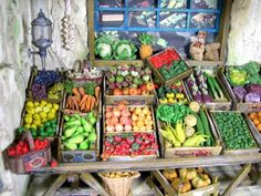 there are many different fruits and vegetables on display