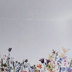 an artistic painting of flowers on a white wall