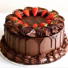 a cake with chocolate frosting and strawberries on top