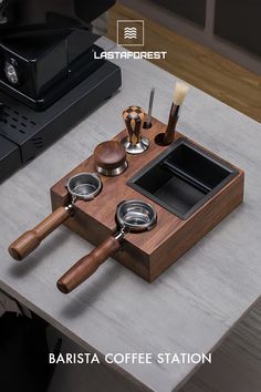 a coffee station with magnifying glass and wooden spoons on the counter top