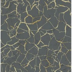 a black and gold wallpaper with cracky paint on the walls in an abstract pattern