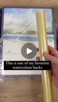 a person is holding a watercolour pencil in front of a card with the words, this is one of my favorite watercolour hacks