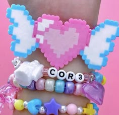 the bracelets are decorated with different types of beads and letters that spell out love