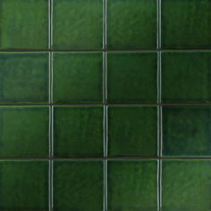 a green tiled wall with white lines on it