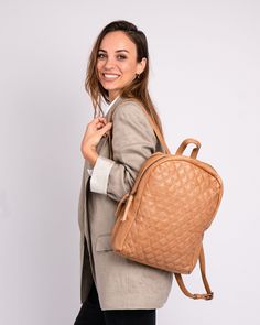 Introducing the Bekema leather backpack, expertly crafted from premium quality leather to meet the highest standards of durability and style. Featuring a soft diamond patterned texture, it exudes refined elegance.The clean lines and understated design make it perfect for those who appreciate a minimalist approach to fashion. PRODUCT DETAILS Dimensions: 10.2" L x 3.5" W x 14.2" H Material: Premium Leather Closure: Zipper Compartments: 2 Pockets / inside: 1 (1 zippered ) Strap handle drop: 8.7" Sh Leather Backpacks, Women Leather Backpack, Butter Yellow, Black Leather Backpack, Diamond Pattern, Leather Bags, Textures Patterns, Leather Backpack, Modern Woman