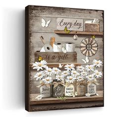 a wooden sign that says every day is a gift with daisies and mason jars