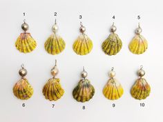 "Sunrise Shell Pearl Pendants. Shells are from Hawaii - all natural! Both color of shells and pearls are all natural. Assorted sizes and colors. Sizes range from 1.25\" W x 2\" H to 1\" W x 1.5\" H. Displayed on yellow 14K gold filled and sterling silver wire. Choose your favorite pendant in the drop down menu. You will receive the exact pendant in the photo. ----------------------------------------------------------------------- We ship in 1 to 3 days from Hawaii by First Class Airmail. Shippin Shells And Pearls, Sunrise Shell, Pearl Jewelry Design, Loose Pearls, Shell Jewelry, Tahiti, Jewellery Display, Pearl Pendant, Oahu