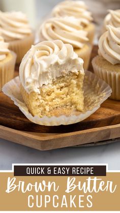 cupcakes with white frosting sitting on top of a cutting board next to the words, quick & easy recipe brown butter cupcakes