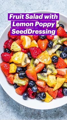 a white bowl filled with sliced fruit on top of a gray countertop next to a knife and fork