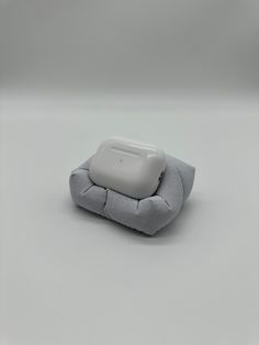 a gray and white object sitting on top of a table